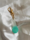 Jeton de caddie blanc et turquoise