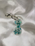 Jeton de caddie blanc et paillettes bleues