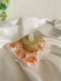 Bougeoir coussin blanc et feuilles cuivrées